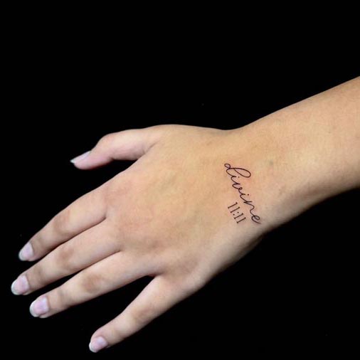 word-divine-with-time-11-11-easy-tattoo-design-female-hand