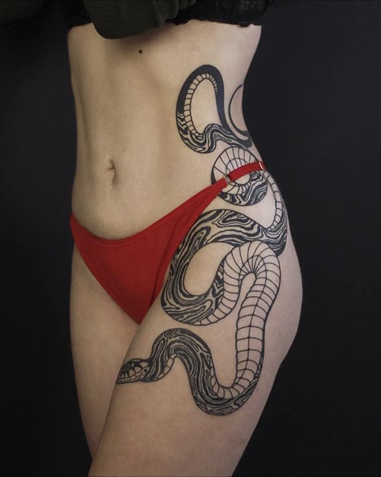 intertwined big snake going down tattoo idea female hip to rib 3