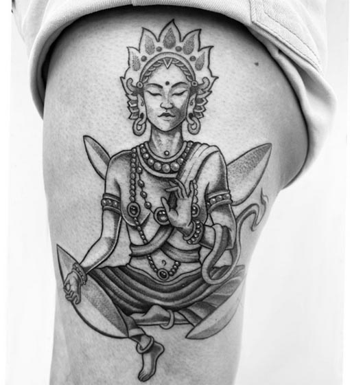 maa tara goddess tattoo woman lower hip black and grey whip shading