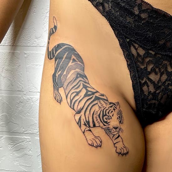 tiger tattoo girl inner hip black and grey