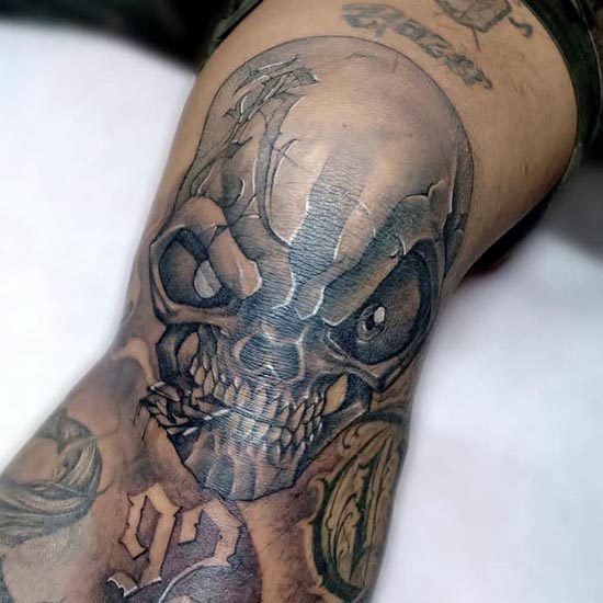 skull tattoo idea unique man knee black and grey