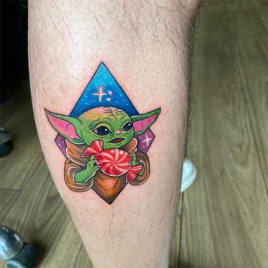 color yoda holding toffee tattoo design man leg