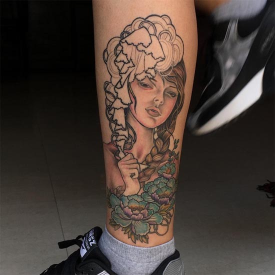 girl face with flowers tattoo woman leg calf