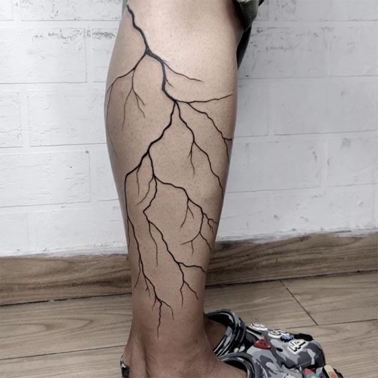 lightening freehand tattoo design idea female half leg