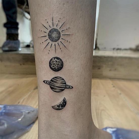 solar system sun earth jupitor moon tattoo design girl leg above ankle