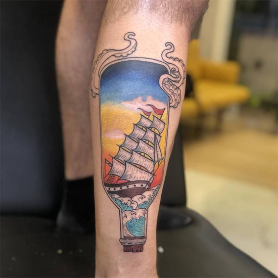 traditional old school tattoo boat ship in bottle male leg