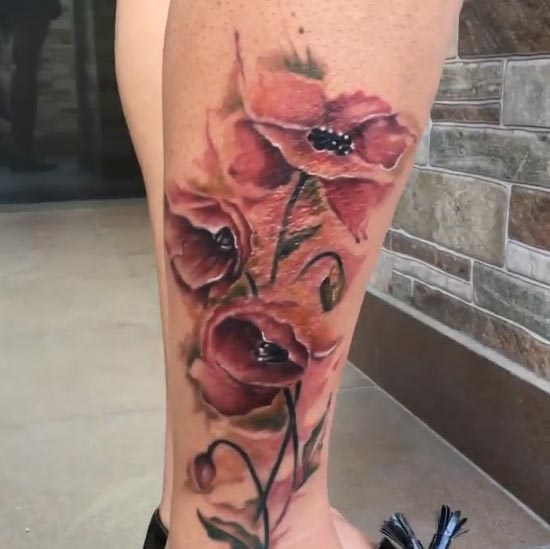 watercolor poppy flower elegant tattoo woman leg