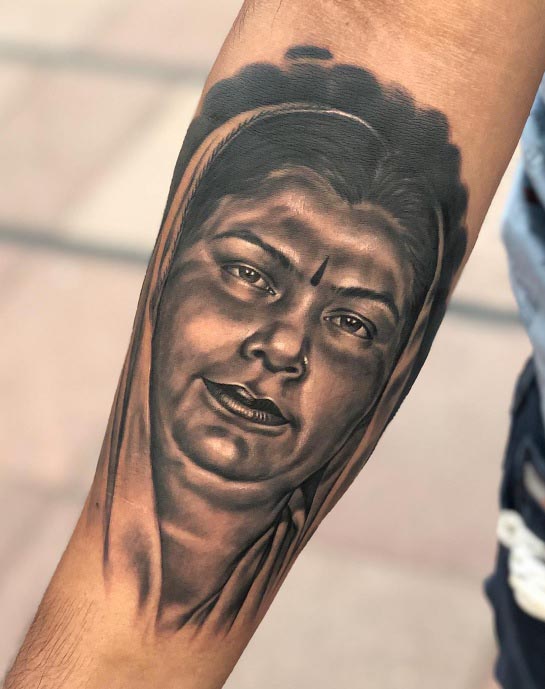 arm mother portrait tattoo