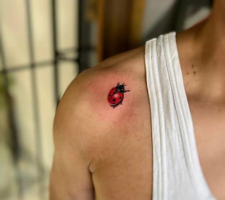 collarbone ladybug tattoo