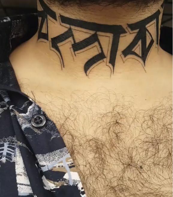 neck tattoo calligraphy scripted initials