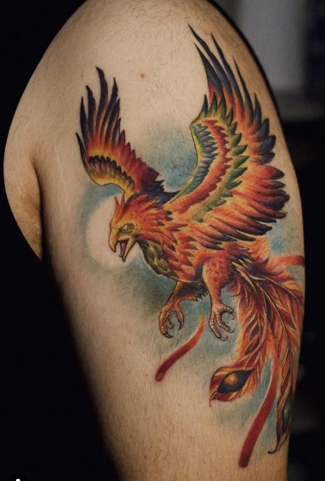 upper arm pheonix rising tattoo