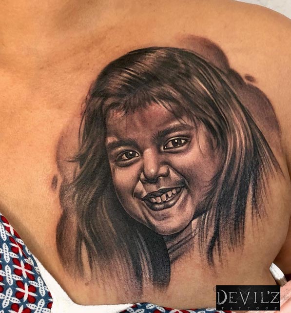 chest female daughter portrait tattoo