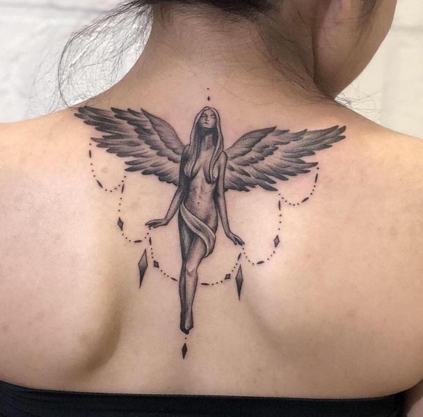 angel tattoo female back neck black and grey