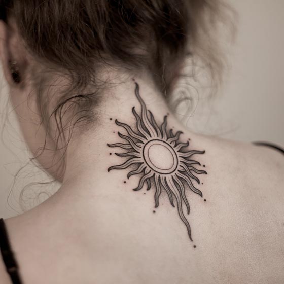 sun tattoo black and grey girl upper behind neck