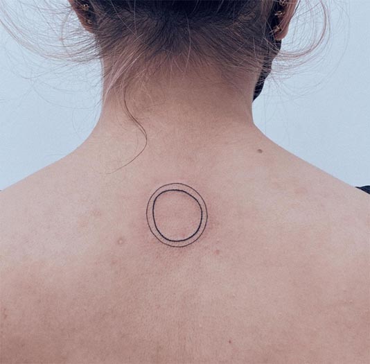 tiny 2 circles tattoo design woman back neck