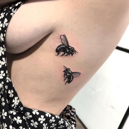 2 bee elegant tattoo design females rib black and grey