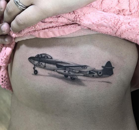 aeroplane miniature tattoo design minimalist female ribcage