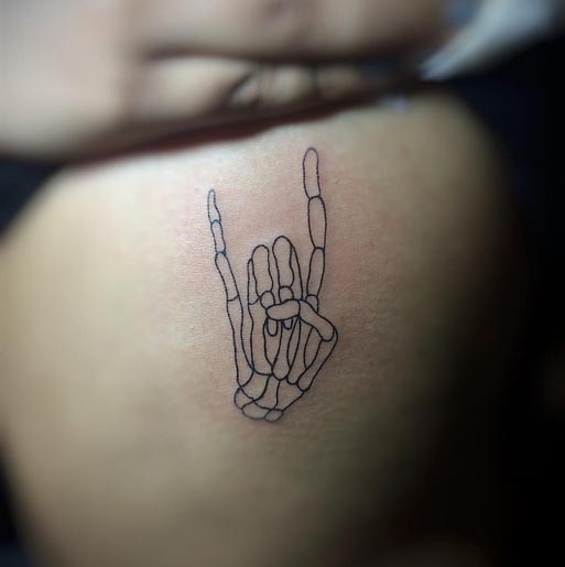 hand skeleton tattoo design female rib