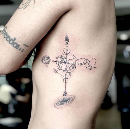 heart and brain compass balance tattoo design male rib under arm