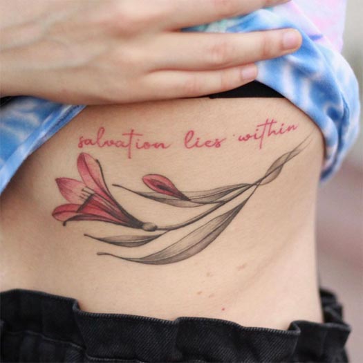 lily flower quote salvation lies within tattoo female ribcage