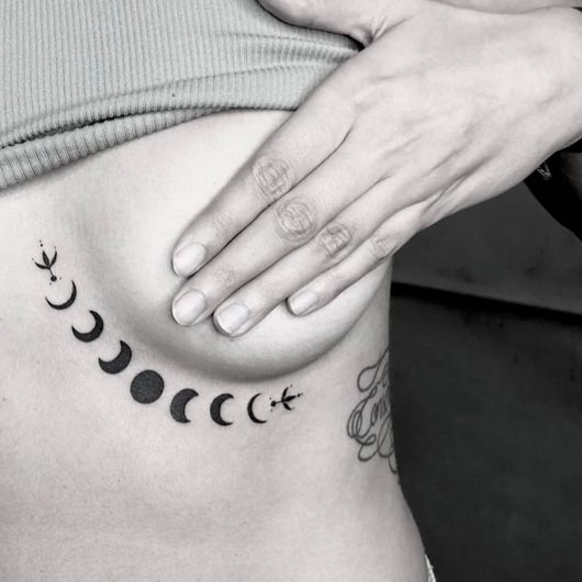 lunar eclipse tattoo design female rib under breast