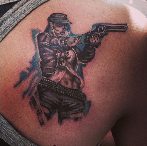 badass tattoo girl holding gun male back shoulder