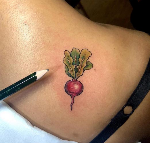 small radish tattoo design woman right back shoulder