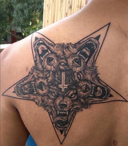 wolf star tattoo black and grey neo traditional new school man back shoulder