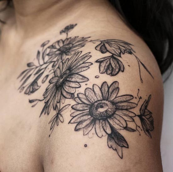 daisies and magnolias botanical tattoo female chest shoulder