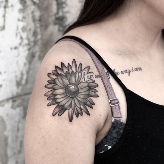 flower tattoo design black and grey woman inner shoulder