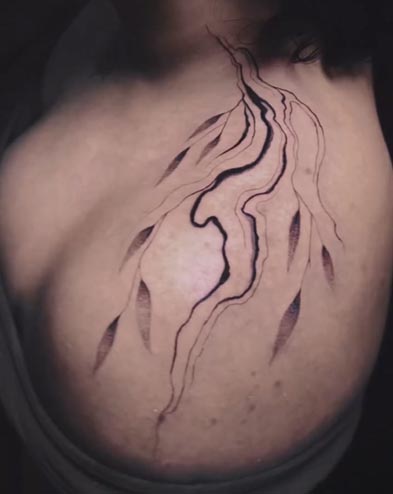 fluid flow abstract lines leaves tattoo female top left shoulder