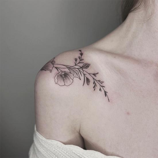 hibiscus flower tattoo linework feminine shoulder