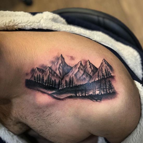 mountain inspired by nature and travel tattoo male between shoulder neck