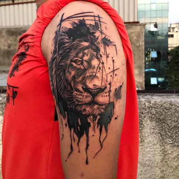 abstract lion face tattoo black and grey man hand shoulder bicep.jpg