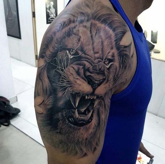 roaring lion tattoo design male shoulder bicep