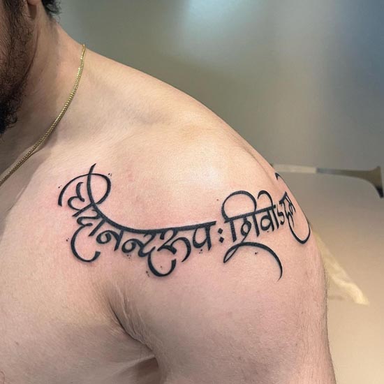 calligraphy sanskrit tattoo design man collarbone shoulder blade