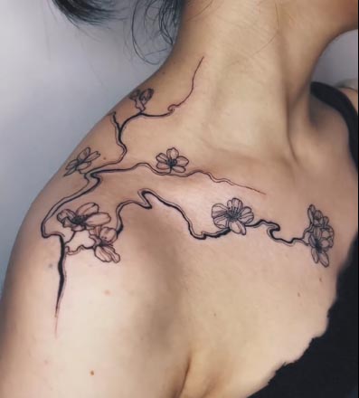 cherry blossom flowers tattoo female shoulder collarbone