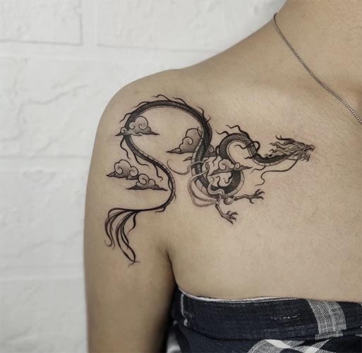 dragon clouds tattoo design woman collarbone