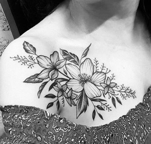 floral tattoo idea woman shoulder collarbone