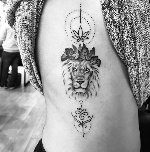 lioness with leaves crown lotus unalome tattoo design woman right side