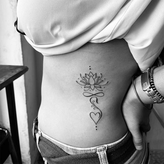 lotus heart tattoo linework minimalist female left side