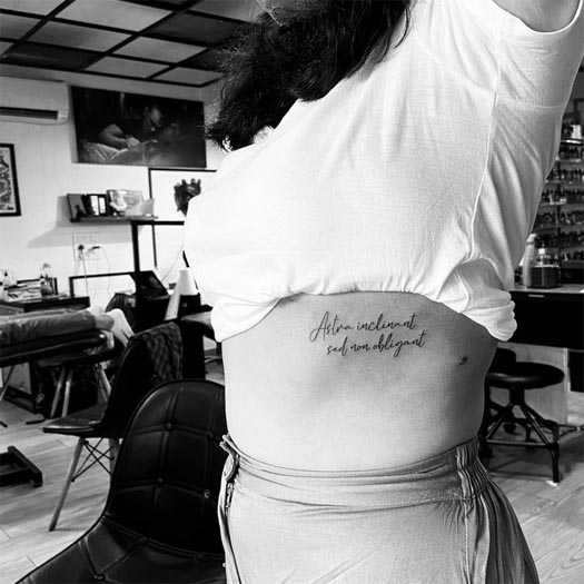 quote latin text astra inclinant sed non obligant tattoo design woman side rib