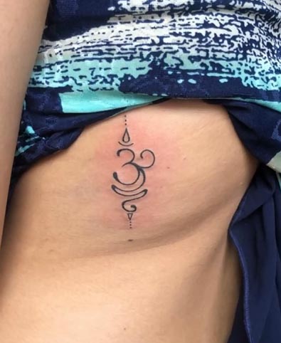 small om sanskrit symbol tattoo design female side