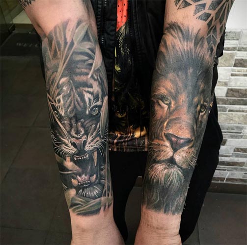 lion on one arm and tiger on other arm tattoo male half sleeve