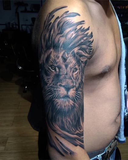 lion realistic big tattoo man half sleeve black and grey 1