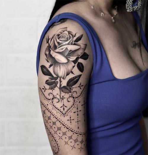 ornamental rose tattoo design female half sleeve black and grey