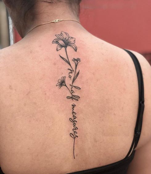 flower quote no half measures tattoo female back spine