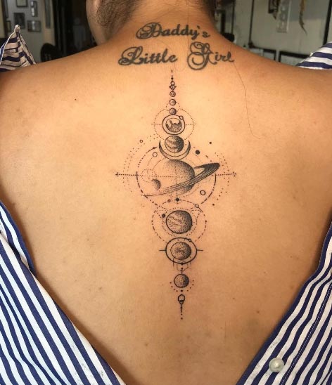 geometric planets tattoo design idea woman spine