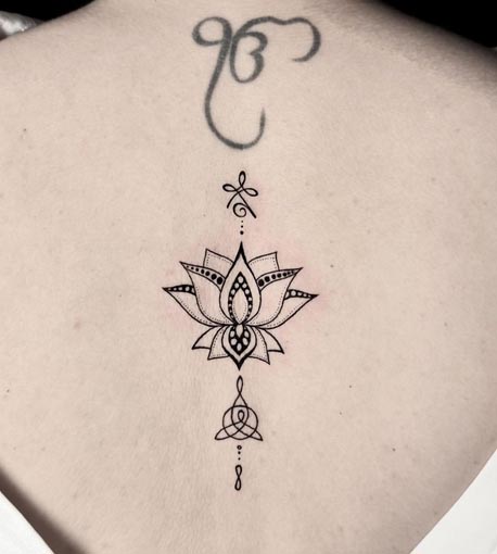 lotus fine line tattoo design female spine