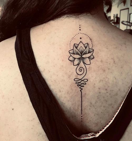 simple lotus unalome tattoo desing linework female spine